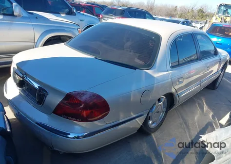2000 Lincoln Continental из США, поврежденный, VIN 1LNHM97V8YY763843